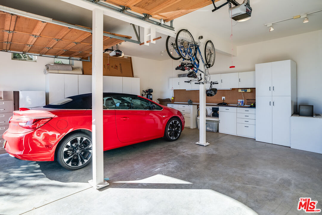 1643 La Vista Del Oceano Santa Barbara, CA 93109 - Photo 32 of 36 a view of a garage and car parked
