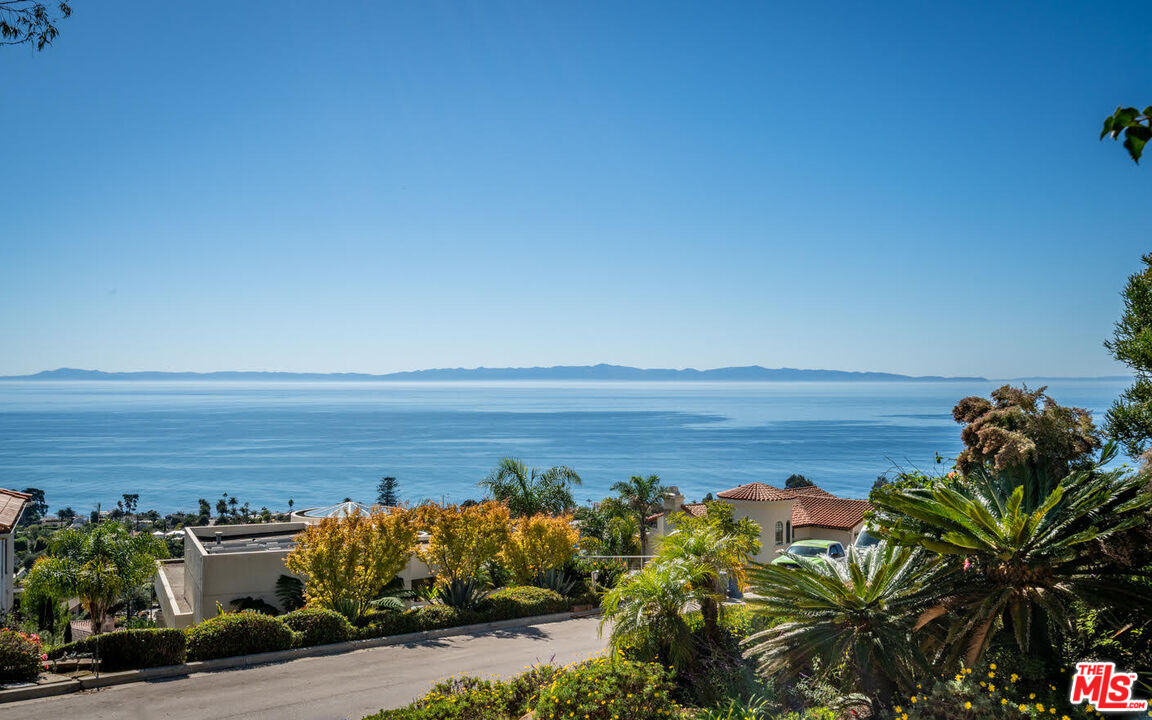 1643 La Vista Del Oceano Santa Barbara, CA 93109 - Photo 5 of 36 a view of a lake with a building in front of it
