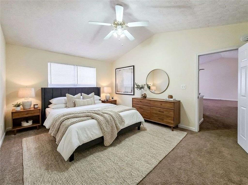 2276 Ramblewood Circle Decatur, GA 30035 - Photo 21 of 34 a bedroom with bed and a chandelier