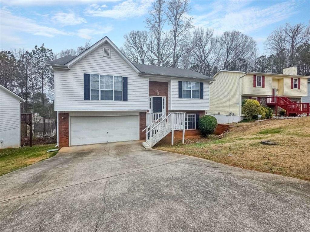 2276 Ramblewood Circle Decatur, GA 30035 - Photo 4 of 34 a view of a house with a yard and garage