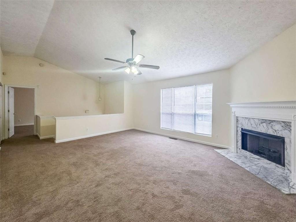 2276 Ramblewood Circle Decatur, GA 30035 - Photo 10 of 34 a view of empty room with fireplace and windows