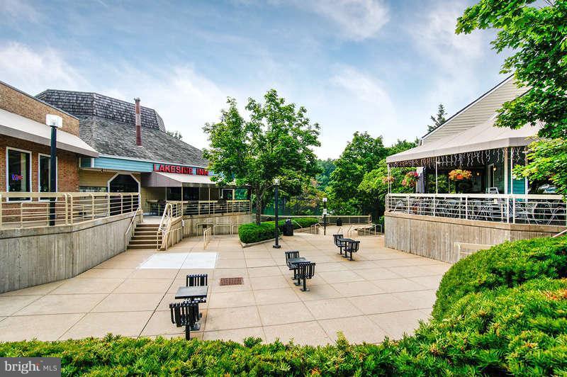 1949 Belmont Ridge Court Reston, VA 20191 - Photo 21 of 23 a view of a patio with table and chairs potted plants with wooden floor and fence