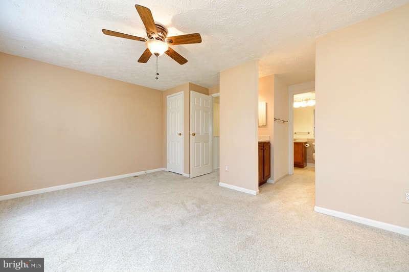 1949 Belmont Ridge Court Reston, VA 20191 - Photo 9 of 23 an empty room with closet and a ceiling fan