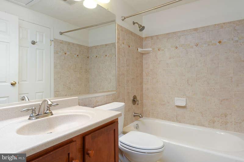 1949 Belmont Ridge Court Reston, VA 20191 - Photo 10 of 23 a bathroom with a sink a toilet and shower