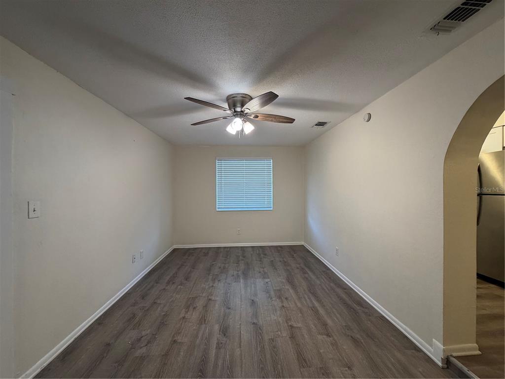 1740 West Walnut Street Tampa, FL 33607 - Photo 12 of 28 wooden floor in an empty room with a window