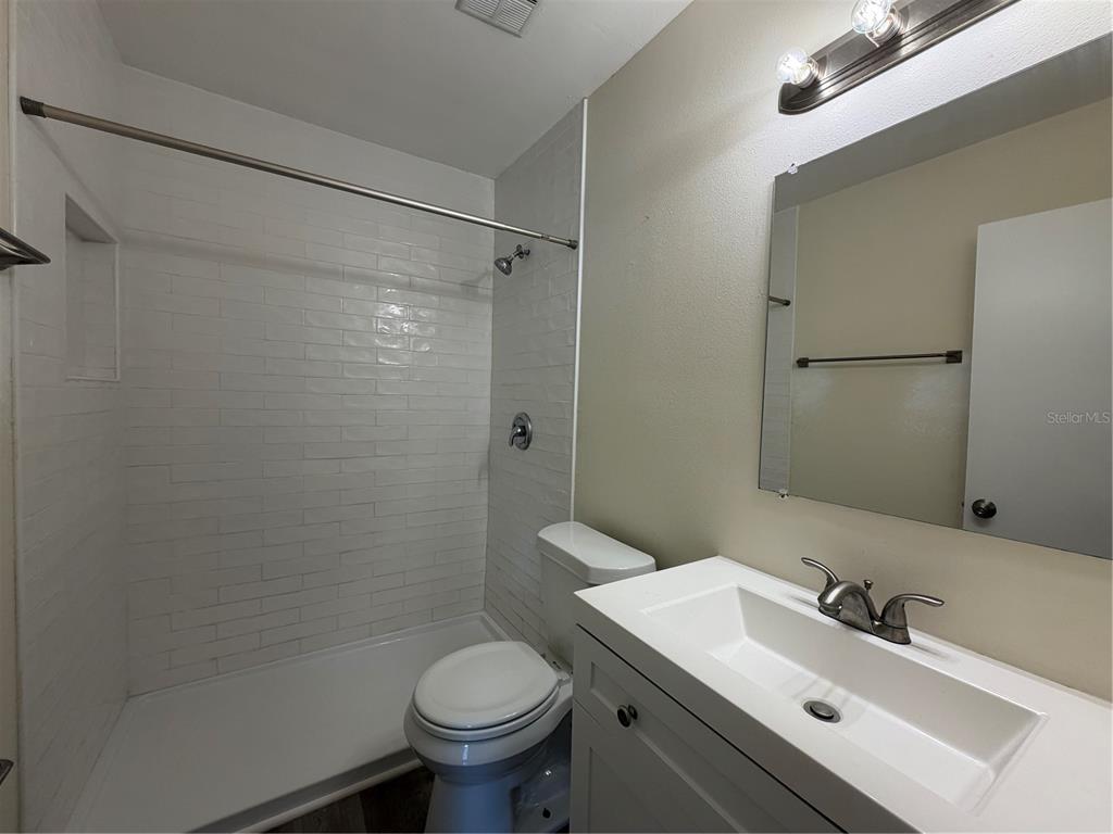 1740 West Walnut Street Tampa, FL 33607 - Photo 14 of 28 a bathroom with a sink toilet and shower