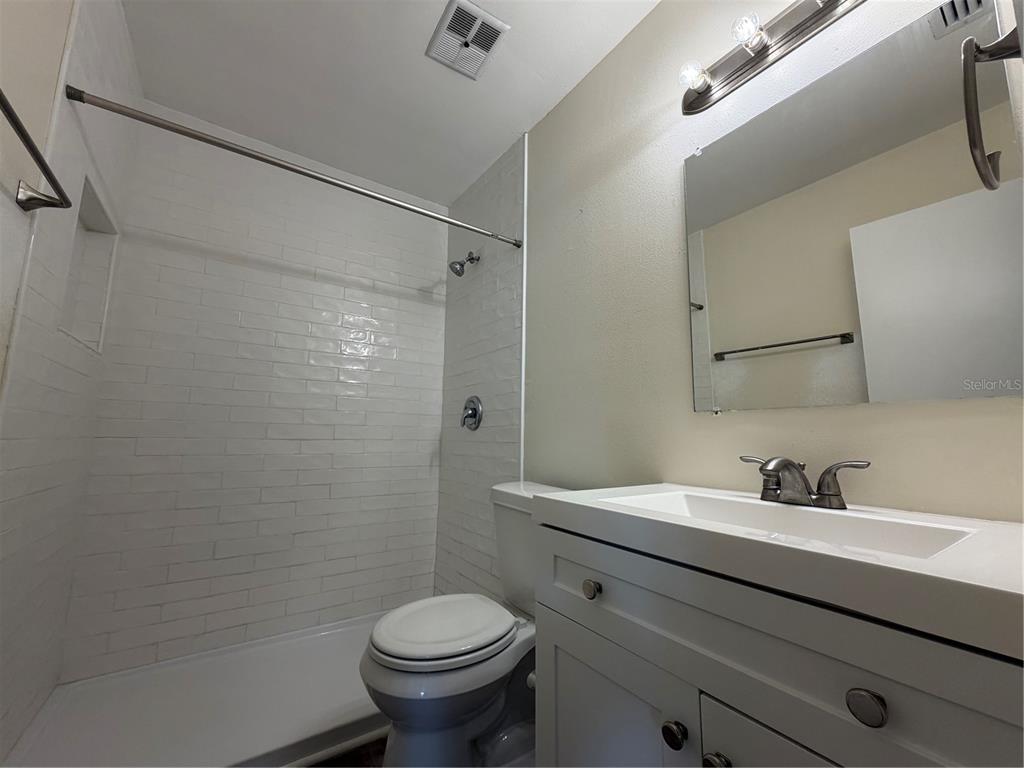 1740 West Walnut Street Tampa, FL 33607 - Photo 15 of 28 a bathroom with a sink toilet and shower