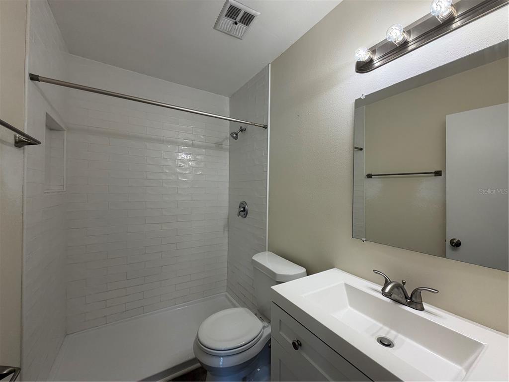 1740 West Walnut Street Tampa, FL 33607 - Photo 16 of 28 a bathroom with a sink toilet and shower