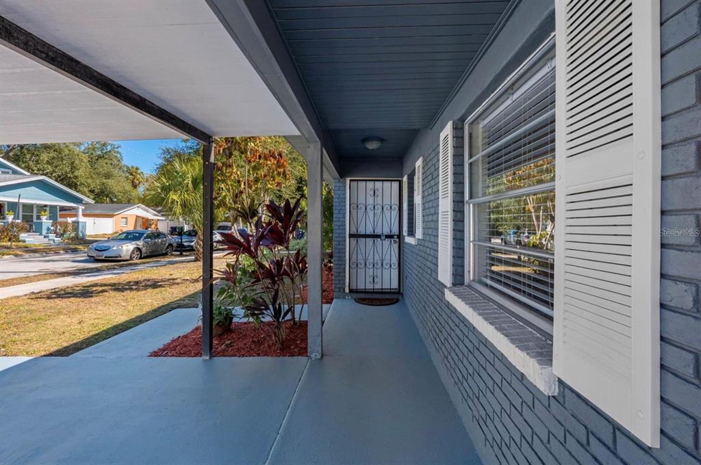 1740 West Walnut Street Tampa, FL 33607 - Photo 2 of 28 a view of a porch and garden