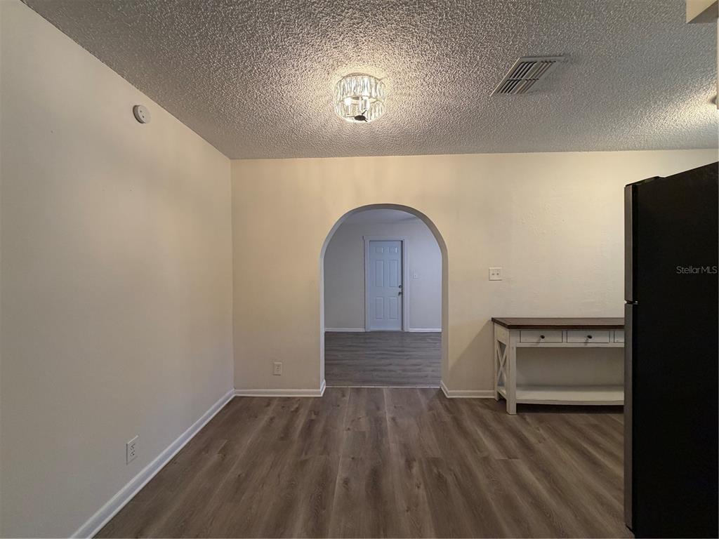 1740 West Walnut Street Tampa, FL 33607 - Photo 6 of 28 a view of empty room with wooden floor