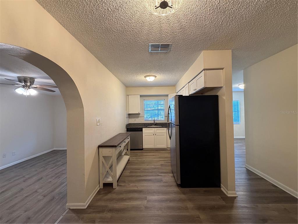 1740 West Walnut Street Tampa, FL 33607 - Photo 10 of 28 a kitchen with a refrigerator and a stove top oven