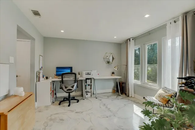 a large kitchen with stainless steel appliances lots of counter top space