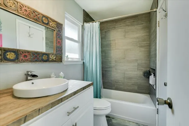 a bedroom with a bed and a book shelf