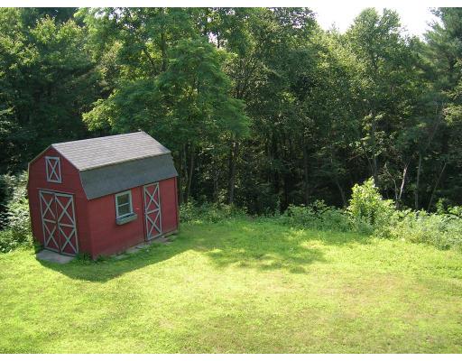 178 Prince Road Southbridge, MA 01550 - Photo 3 of 12 a view of a tiny house with a yard
