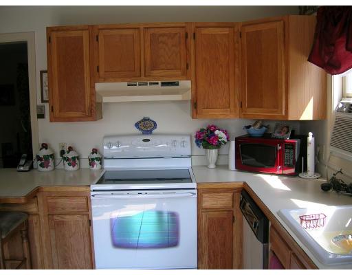 178 Prince Road Southbridge, MA 01550 - Photo 6 of 12 a kitchen with a stove and a microwave