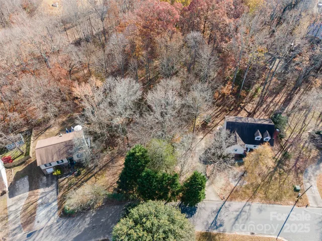 a aerial view of a house with a yard