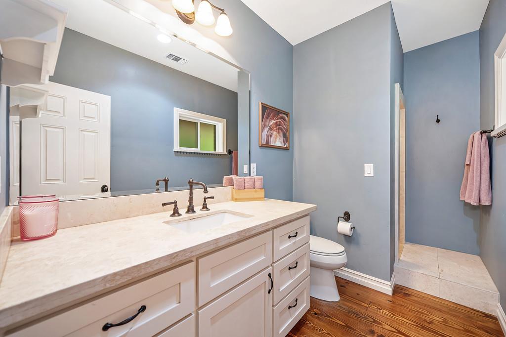 3557 Val Verde Road Loomis, CA 95650 - Photo 33 of 71 a bathroom with a sink a toilet and shower