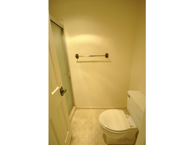 555 Palm Avenue, Unit 207 Millbrae, CA 94030 - Photo 16 of 21 a bathroom with a granite countertop toilet and a sink