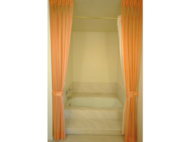 555 Palm Avenue, Unit 207 Millbrae, CA 94030 - Photo 17 of 21 a bathroom with a glass shower door