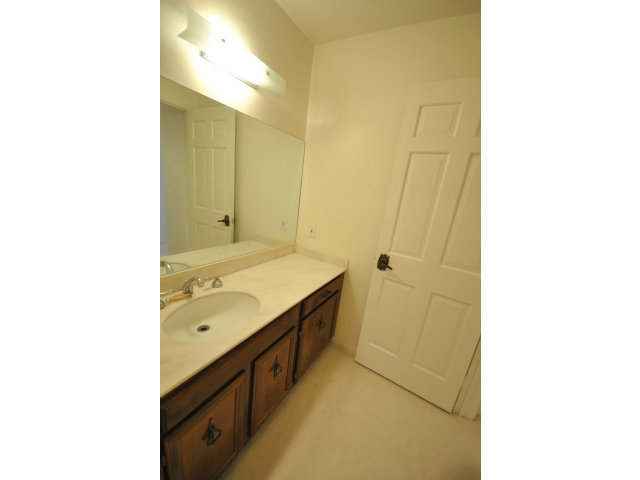 555 Palm Avenue, Unit 207 Millbrae, CA 94030 - Photo 21 of 21 a bathroom with a sink and a mirror