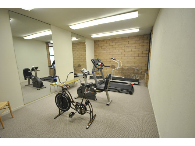 555 Palm Avenue, Unit 207 Millbrae, CA 94030 - Photo 4 of 21 a room with gym equipment and mirror