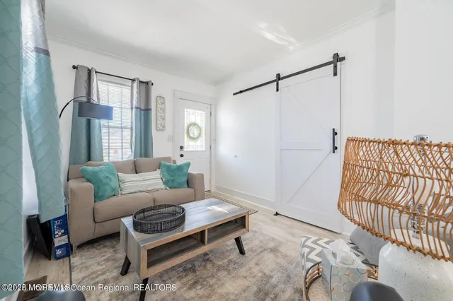 a living room with furniture and a rug