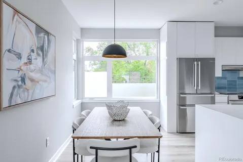 a dining room with furniture and window