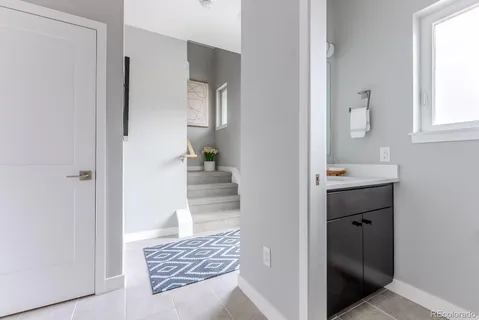 a bedroom with bed and a window
