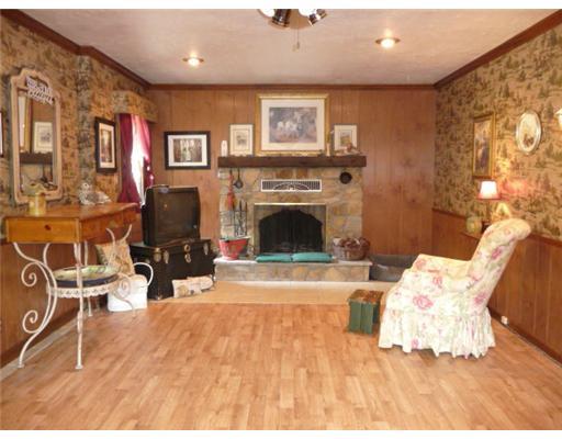 160 McFann Road Valencia, PA 16059 - Photo 10 of 18 Family Room. Stone fireplace is wood-burning. Door from this room leads to garage.