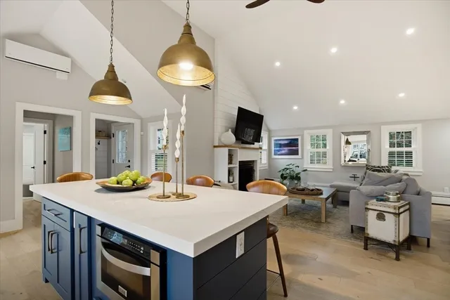 a kitchen with sink cabinets and chairs