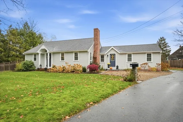 a front view of a house with a garden