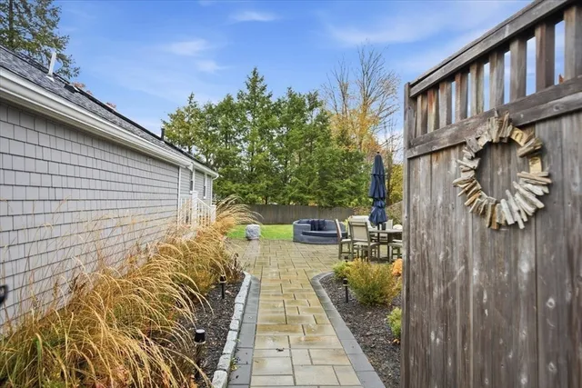 a view of a pathway with a backyard