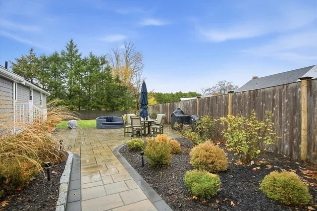 a view of a backyard with sitting area