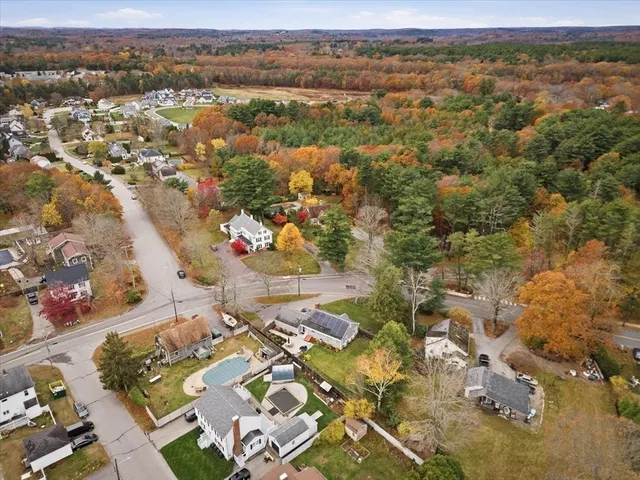 an aerial view of residential houses with outdoor space