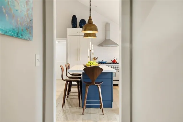 a table with chairs and a wooden floor