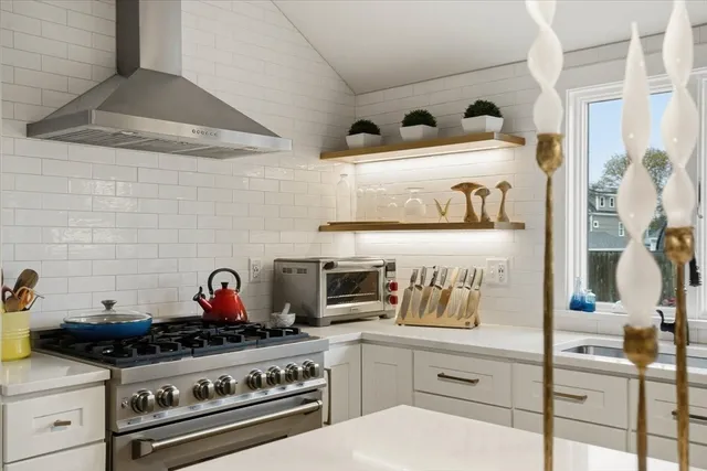 a kitchen with a stove and cabinets