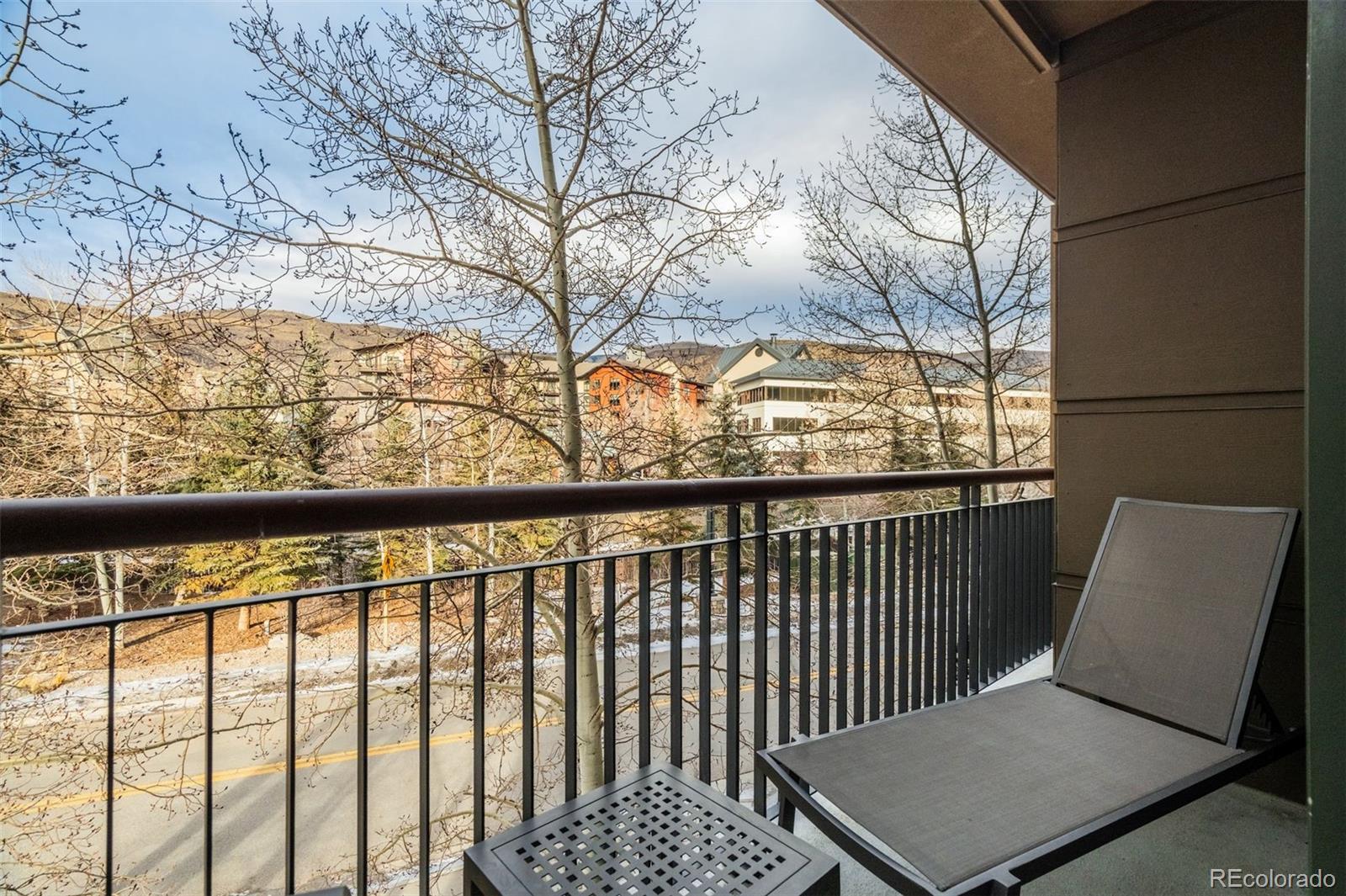 126 Riverfront Lane, Unit 200 Avon, CO 81620 - Photo 23 of 49 a view of a chair in the balcony