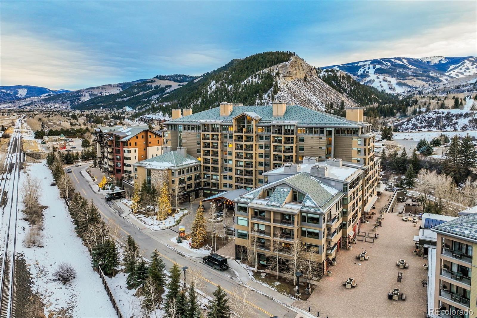 126 Riverfront Lane, Unit 200 Avon, CO 81620 - Photo 4 of 49 a view of a large building with a city view