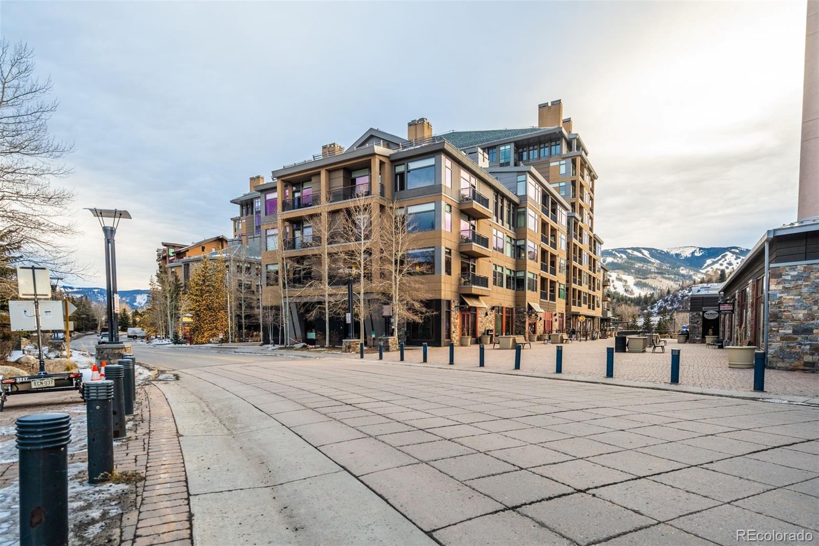 126 Riverfront Lane, Unit 200 Avon, CO 81620 - Photo 47 of 49 a view of tall building with large trees