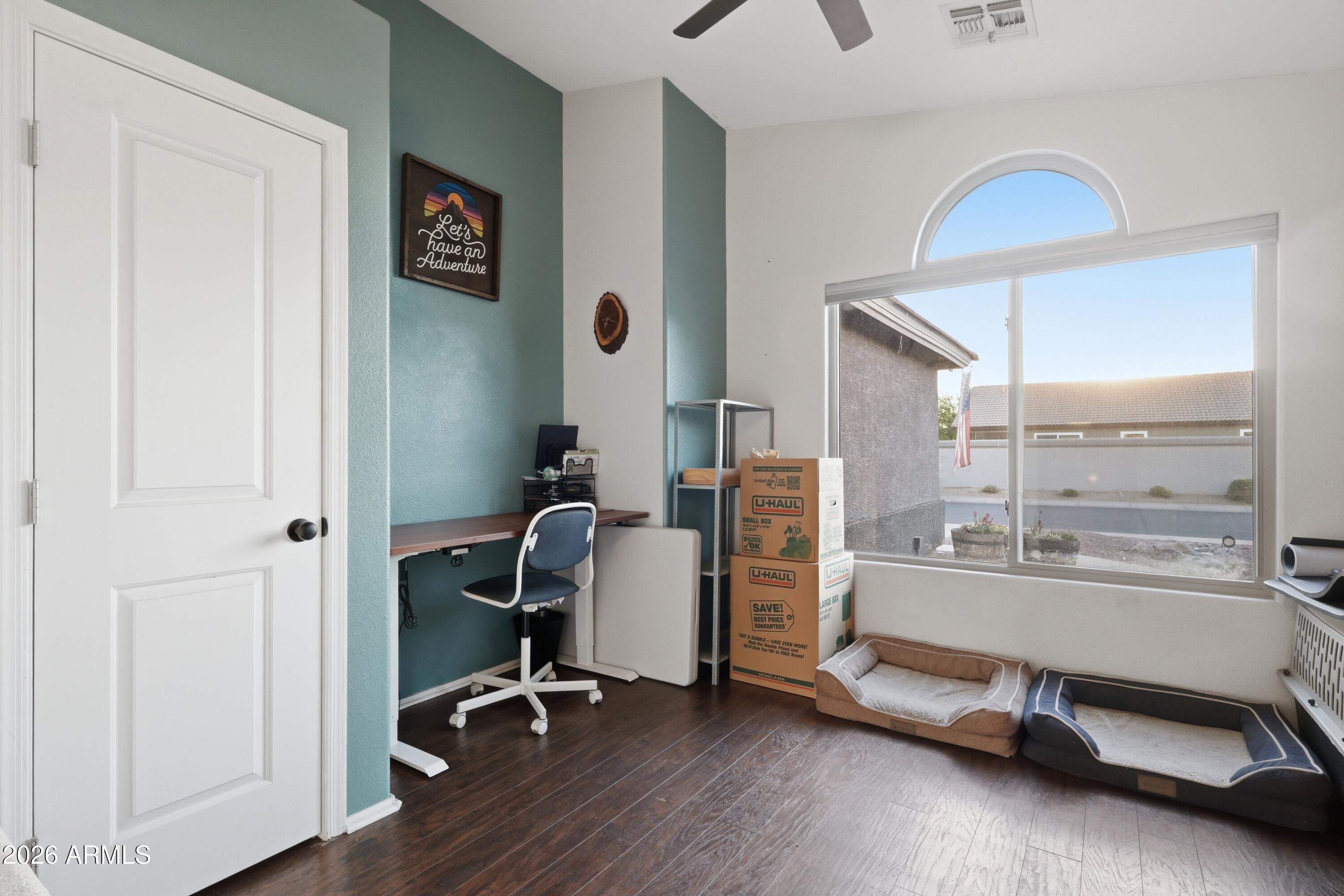 661 North Joshua Tree Lane Gilbert, AZ 85234 - Photo 19 of 47 a view of a workspace with gym equipment