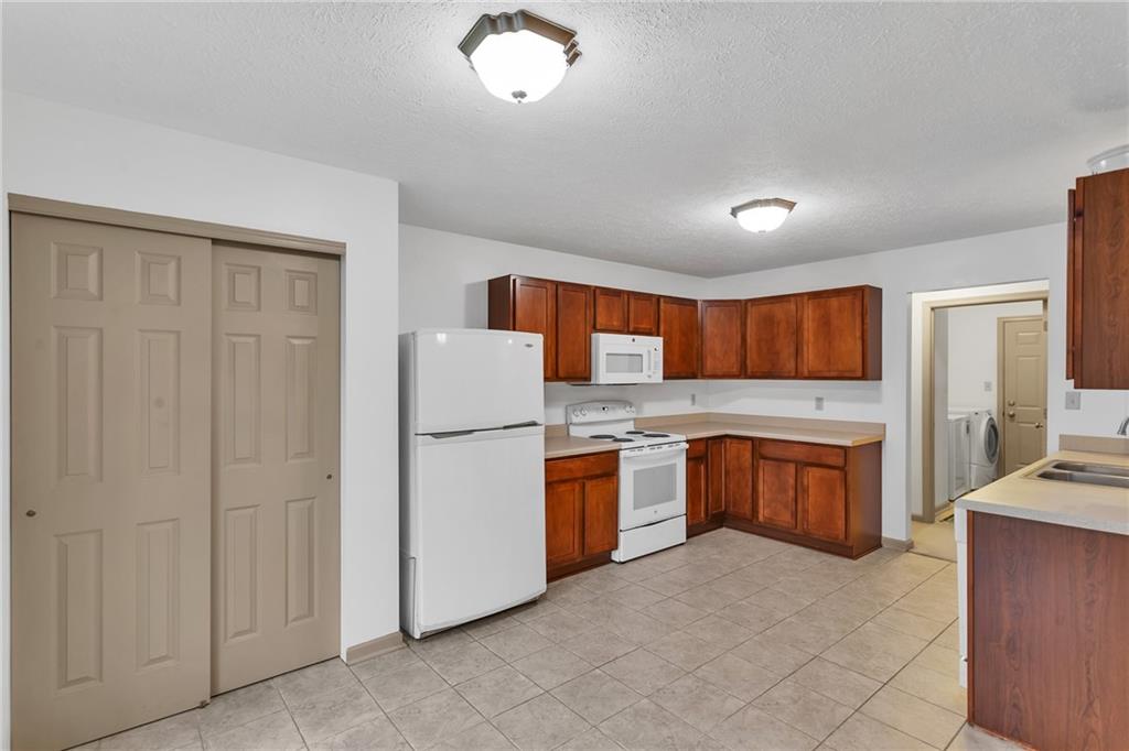 188 Congruity Road Greensburg, PA 15601 - Photo 24 of 50 a kitchen with refrigerator stove microwave and stove