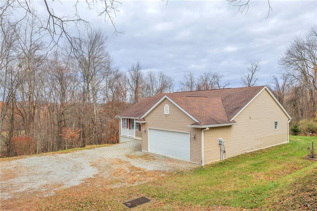 188 Congruity Road Greensburg, PA 15601 - Photo 5 of 50 a view of a white house with a yard and garage