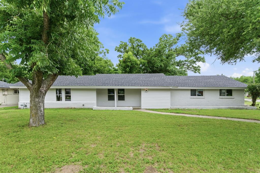 507 Country Club Road Cleburne, TX 76033 - Photo 1 of 39 Ranch-style exterior with a dark gray shingle roof, white siding, and a light gray painted brick facade
