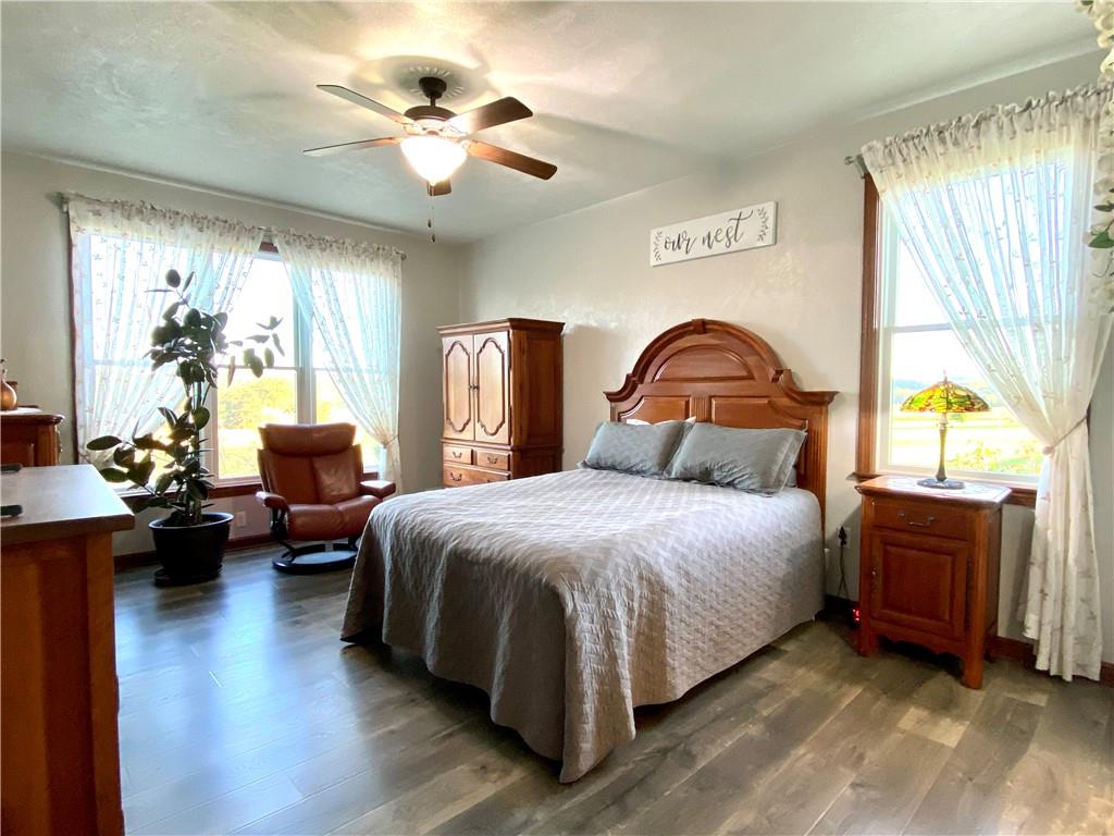 440 Wilson Road Worthington, PA 16262 - Photo 13 of 48 a bedroom with a bed and dresser with wooden floor