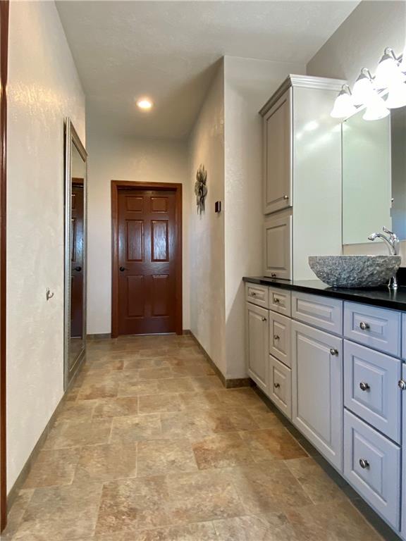 440 Wilson Road Worthington, PA 16262 - Photo 15 of 48 a spacious bathroom with a granite countertop sink and a mirror