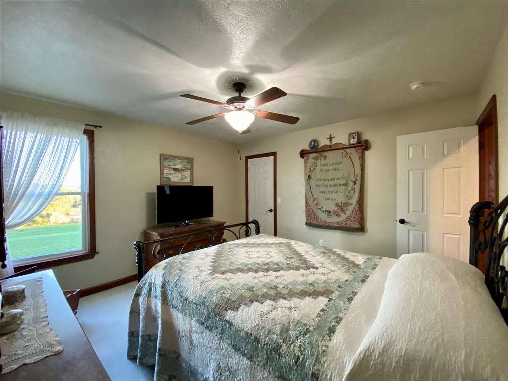 440 Wilson Road Worthington, PA 16262 - Photo 18 of 48 a bedroom with a bed and a flat screen tv