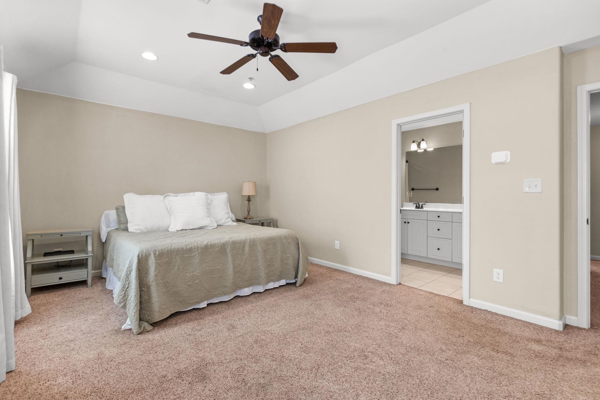 2275 McVay Road, Unit 2275 Germantown, TN 38138 - Photo 27 of 40 a bedroom with a bed and a chandelier