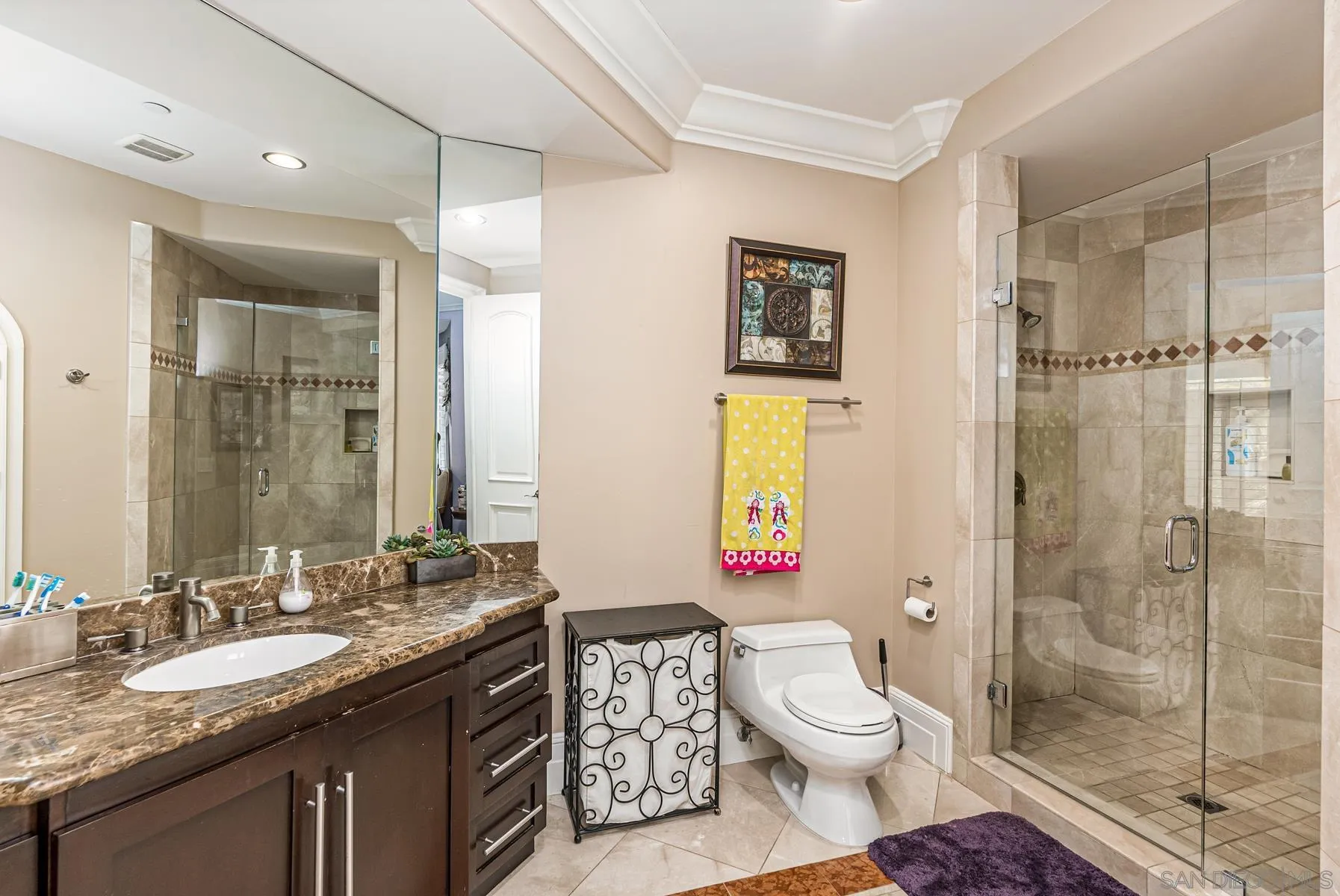 2871 Gate 3 Place Chula Vista, CA 91914 - Photo 44 of 73 a bathroom with a granite countertop toilet sink and shower