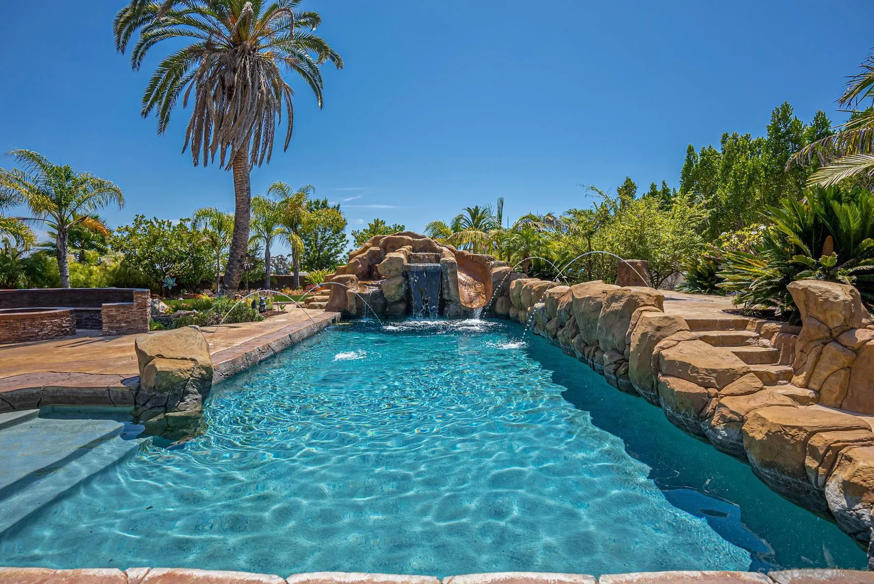 2871 Gate 3 Place Chula Vista, CA 91914 - Photo 53 of 73 a view of a backyard with lawn chairs plants and palm tree