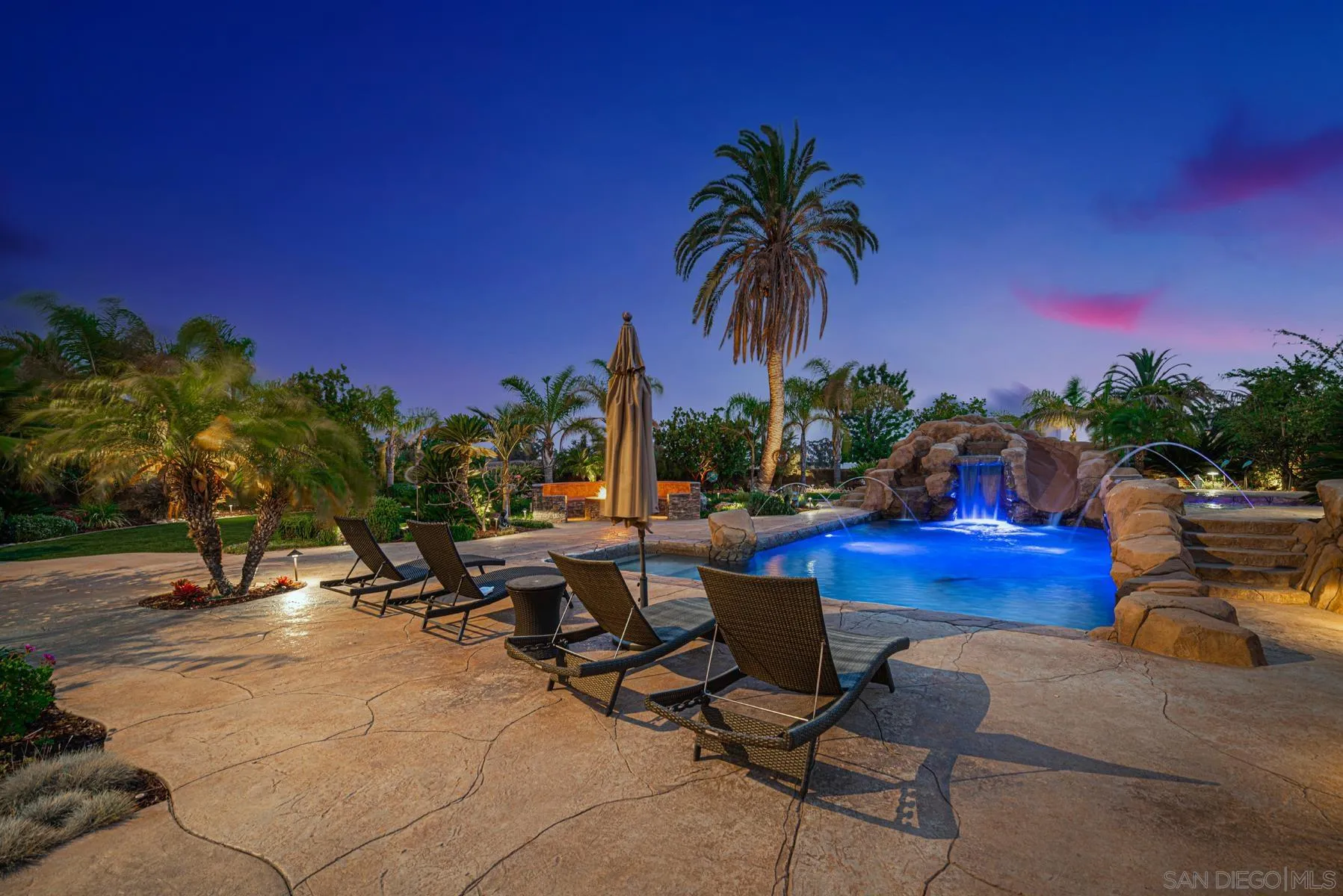 2871 Gate 3 Place Chula Vista, CA 91914 - Photo 65 of 73 a row of palm trees and swimming pool in the backyard of a house
